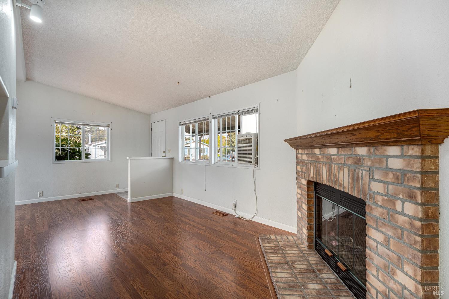 146 Westgate Circle Santa Rosa, CA 95401 - Photo 18 of 41 an empty room with windows and fireplace