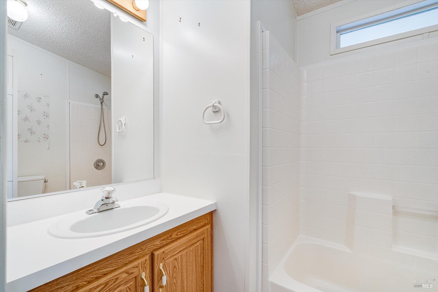 146 Westgate Circle Santa Rosa, CA 95401 - Photo 26 of 41 a bathroom with a sink and a mirror