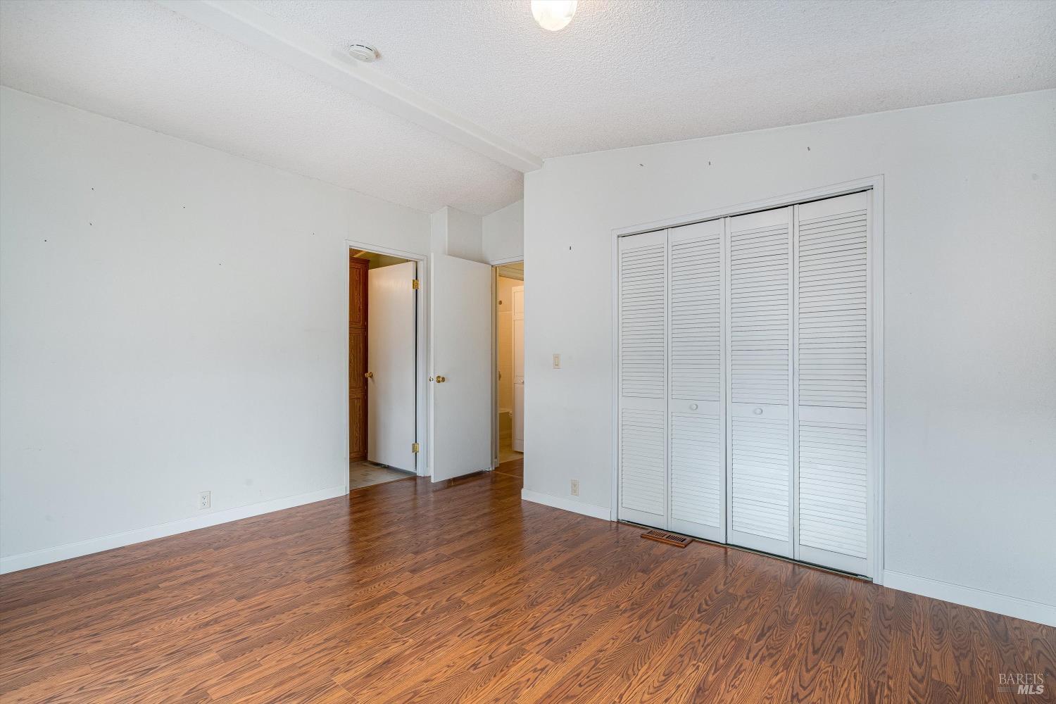 146 Westgate Circle Santa Rosa, CA 95401 - Photo 29 of 41 an empty room with wooden floor and closet