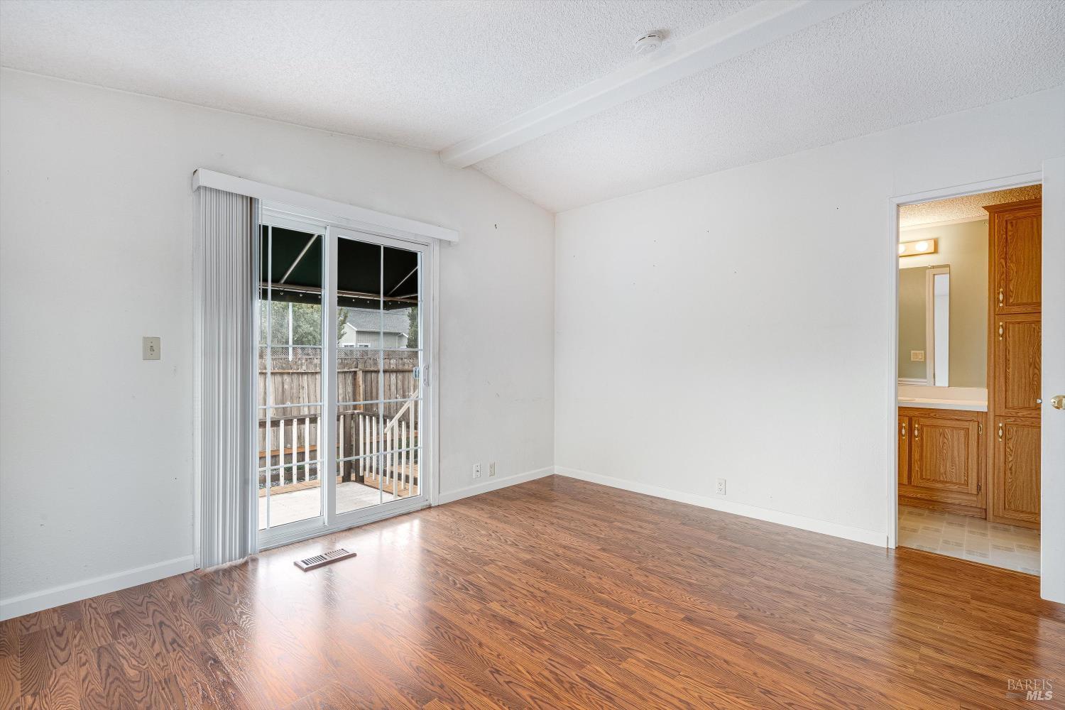146 Westgate Circle Santa Rosa, CA 95401 - Photo 30 of 41 a view of an empty room with wooden floor and a window