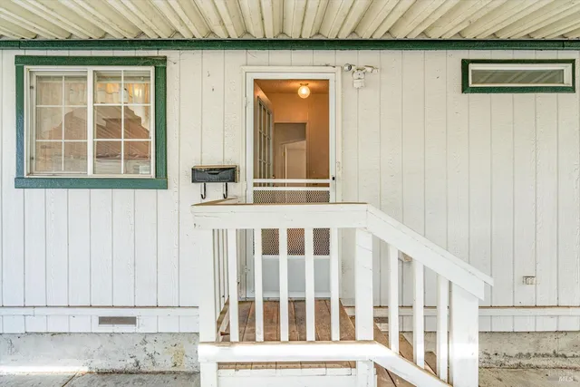 a view of a door and a window