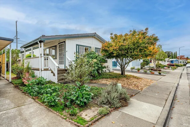 a front view of a house with garden
