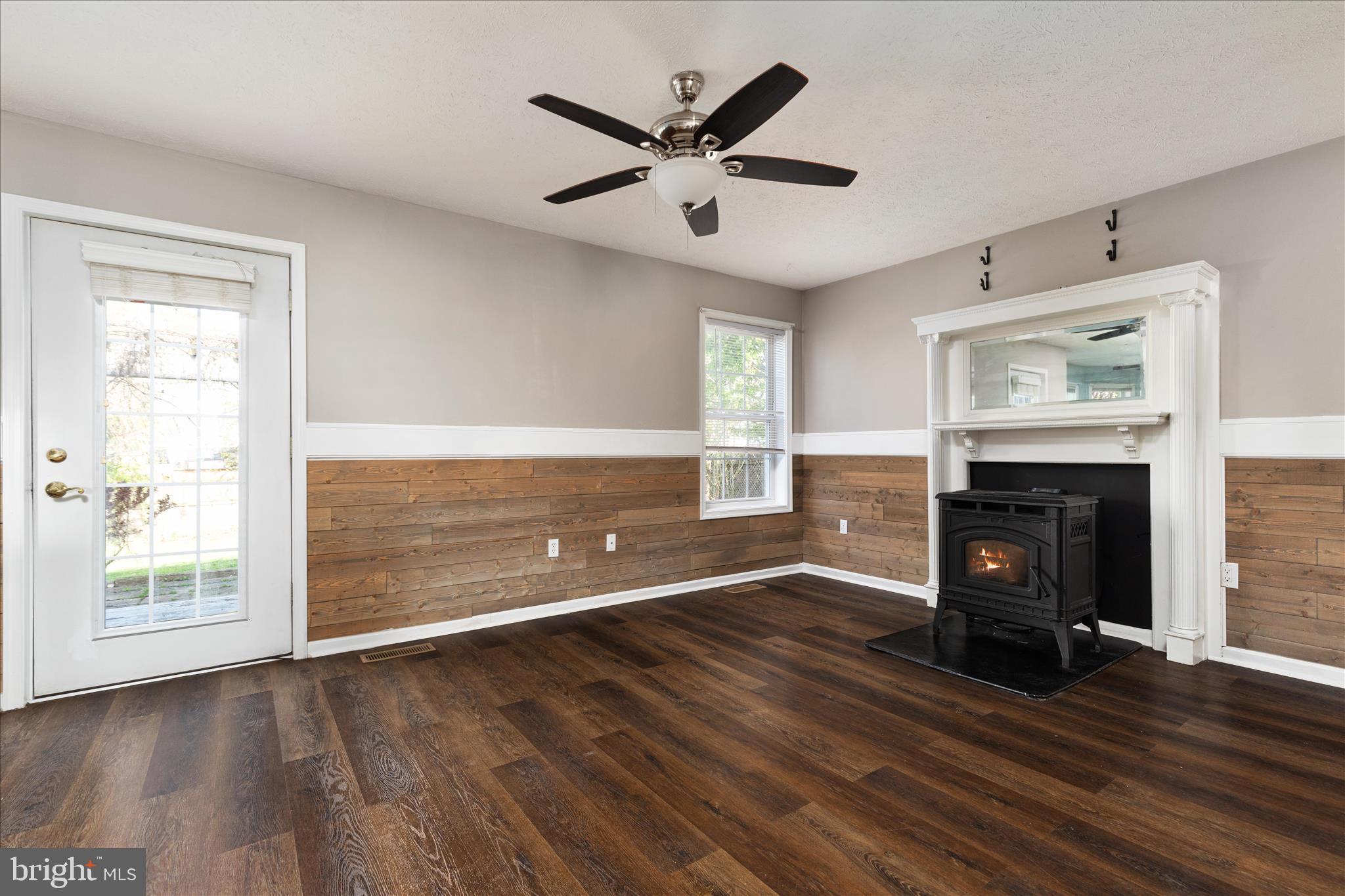 109 Fenimore Drive Inwood, WV 25428 - Photo 11 of 34 a living room with fireplace and wooden floor