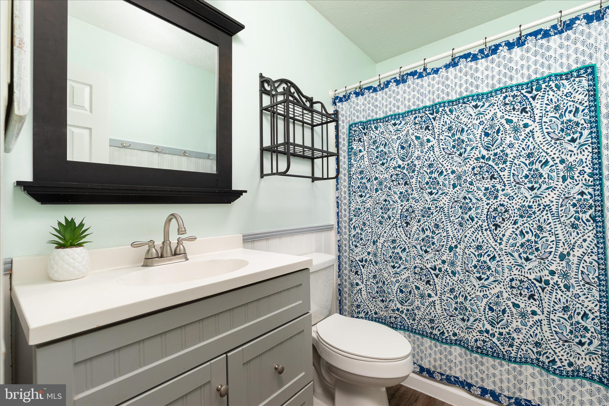 109 Fenimore Drive Inwood, WV 25428 - Photo 21 of 34 a bathroom with a sink mirror and toilet
