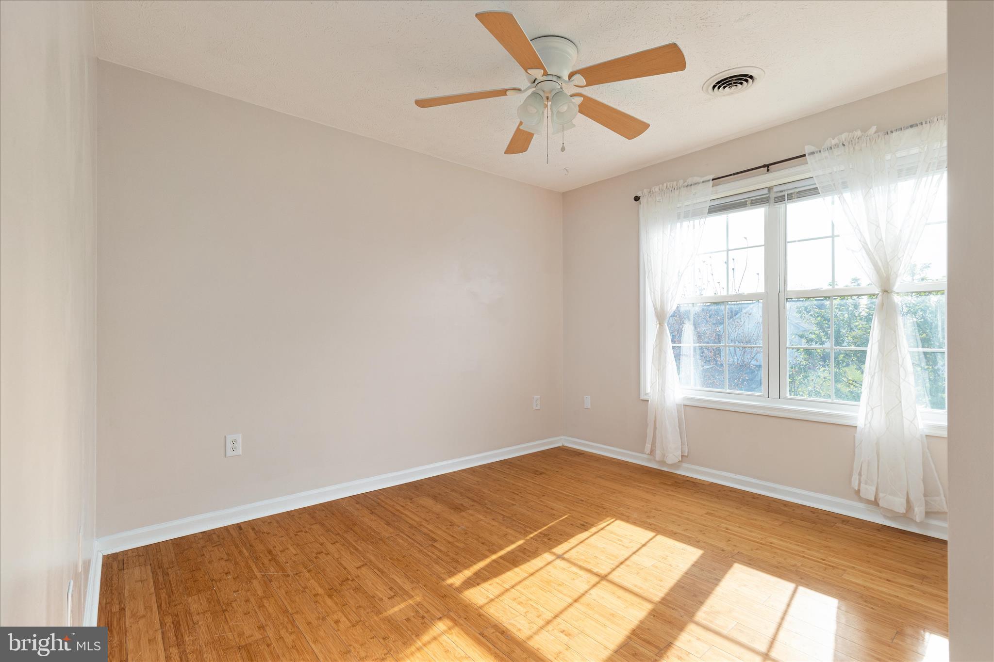 109 Fenimore Drive Inwood, WV 25428 - Photo 22 of 34 a view of a big room with wooden floor and windows