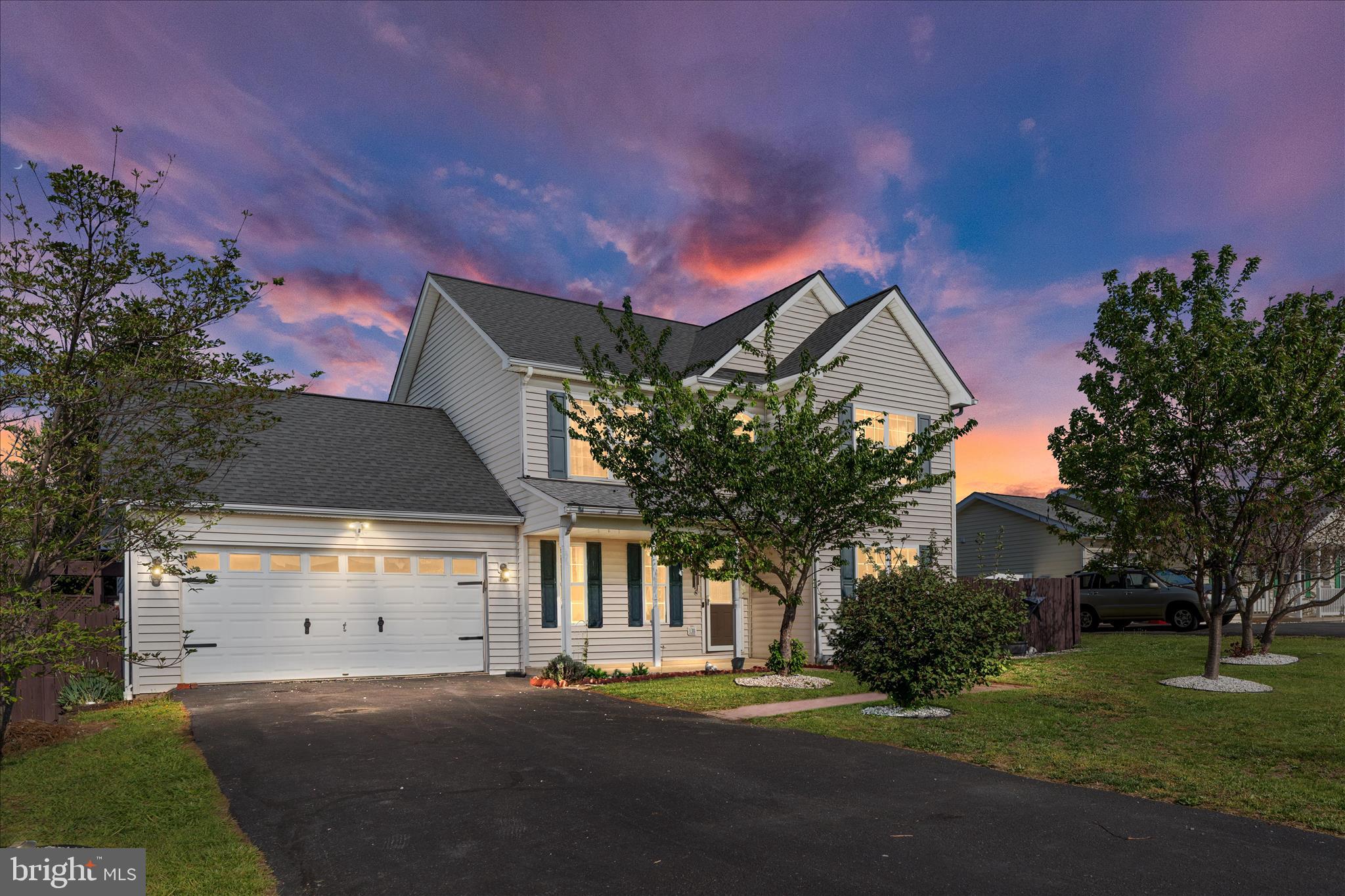 109 Fenimore Drive Inwood, WV 25428 - Photo 34 of 34 a front view of a house with a yard and a garage