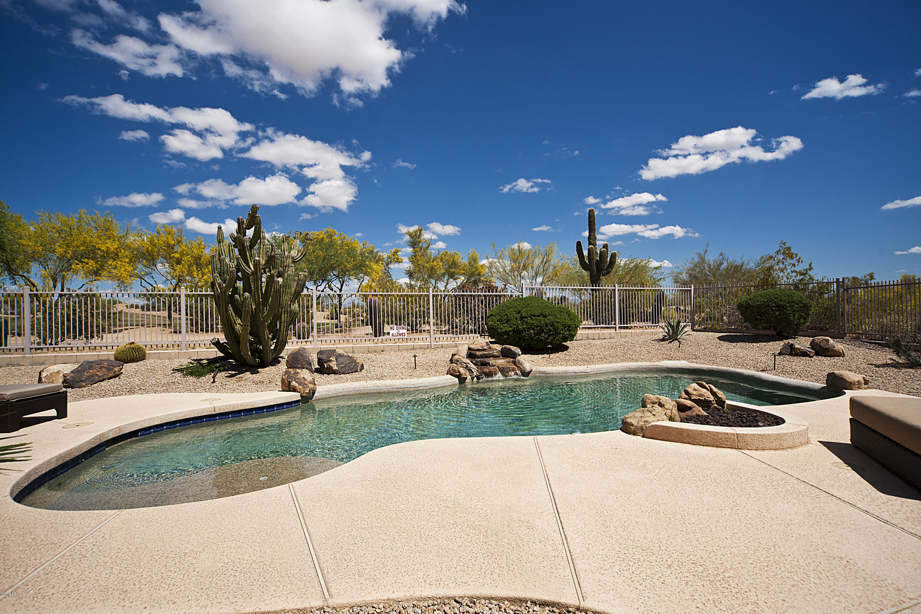 5258 East Hashknife Road Phoenix, AZ 85054 - Photo 22 of 44 SPARKLING POOL AND WATER FALL