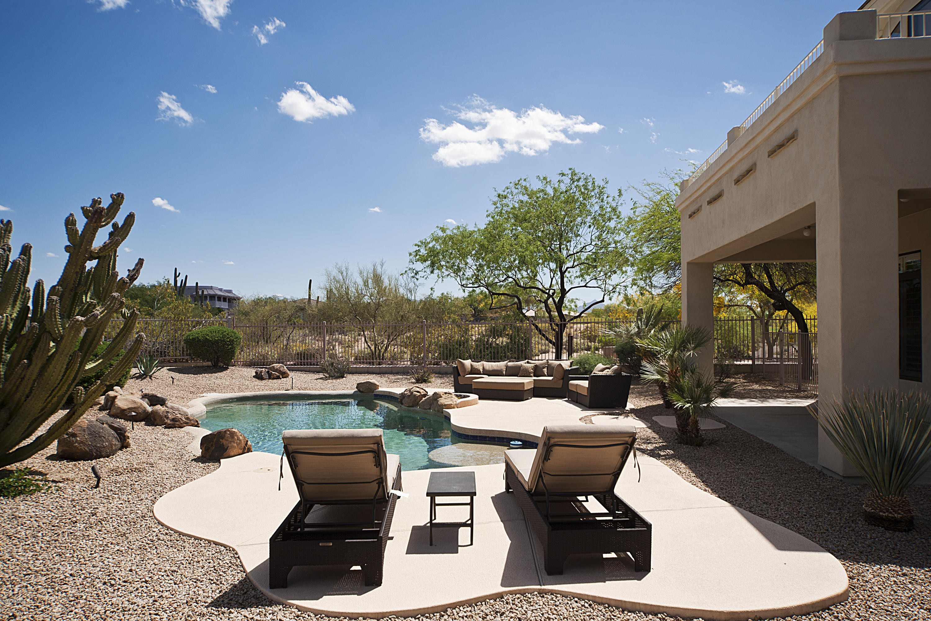 5258 East Hashknife Road Phoenix, AZ 85054 - Photo 23 of 44 LOUNGES AROUND THE POOL