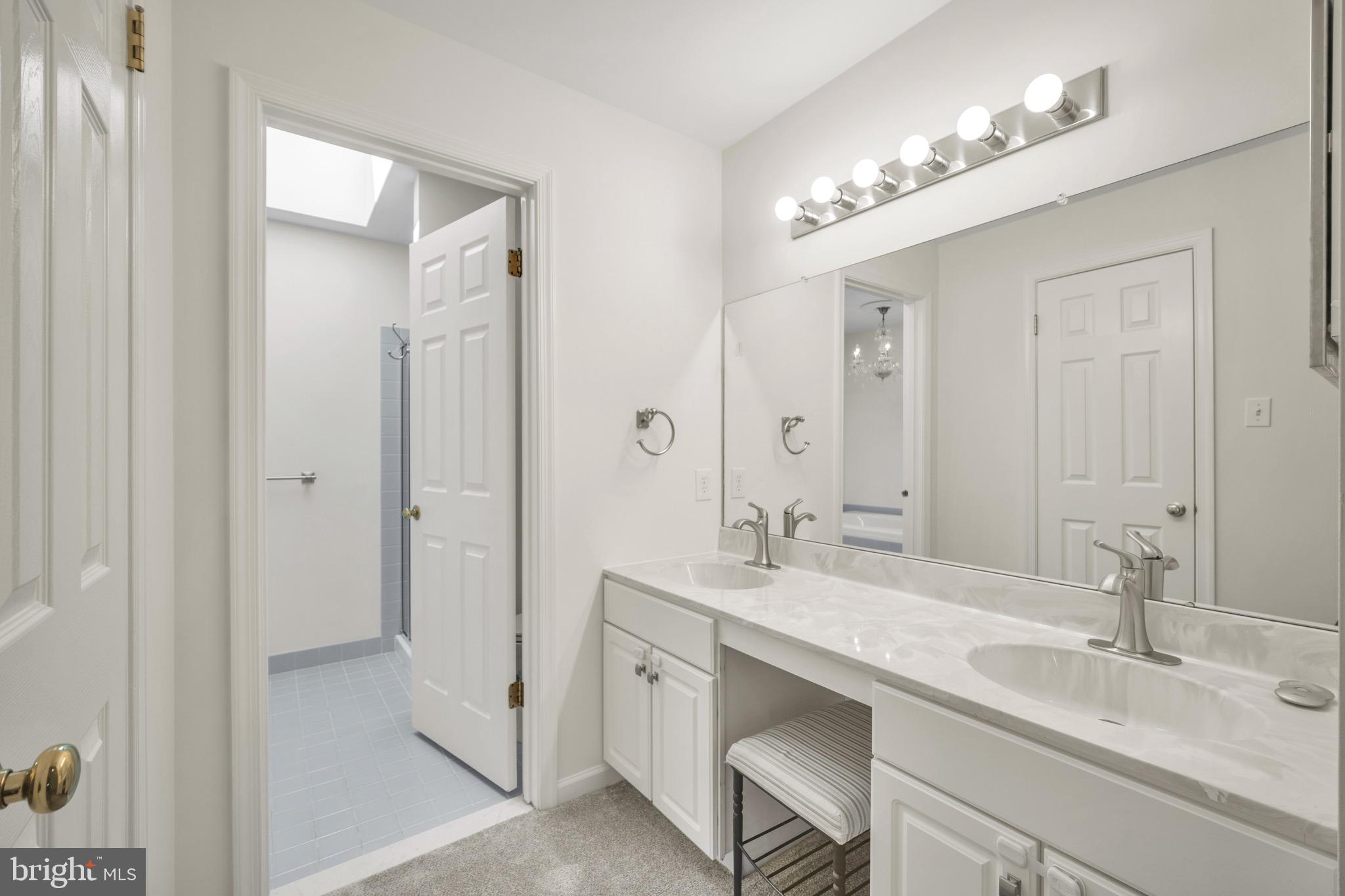 2402 Waterford Road, Unit 94 Yardley, PA 19067 - Photo 15 of 28 a bathroom with a sink double vanity and a mirror