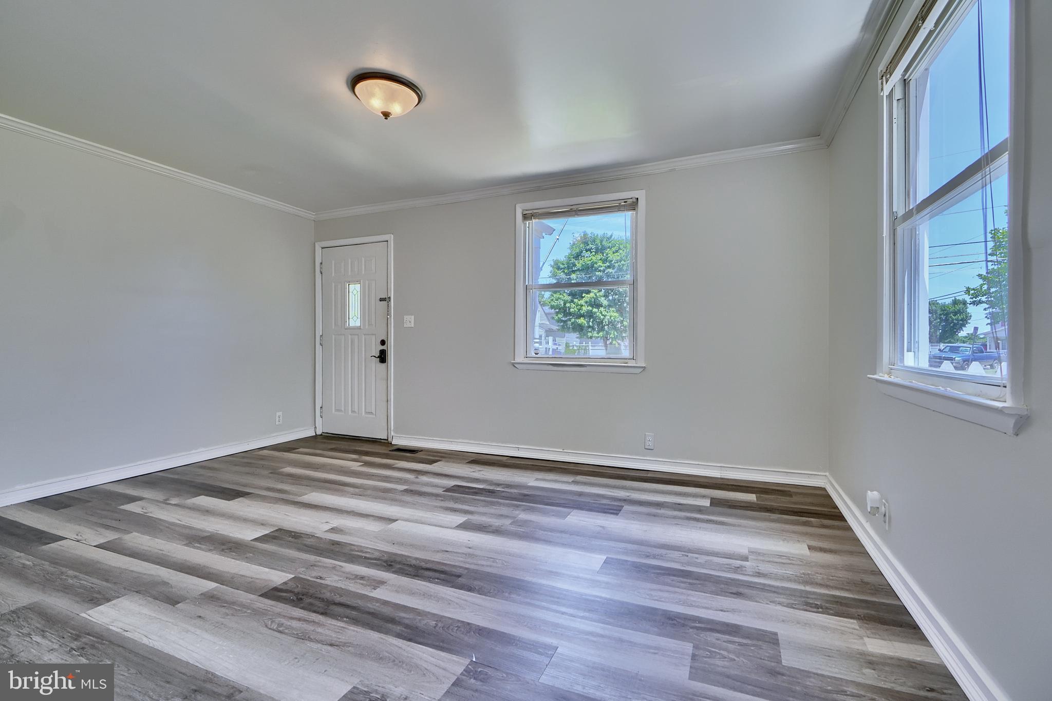 8239 Bullneck Road Dundalk, MD 21222 - Photo 25 of 35 Beautiful LVP floors in family room & kitchen