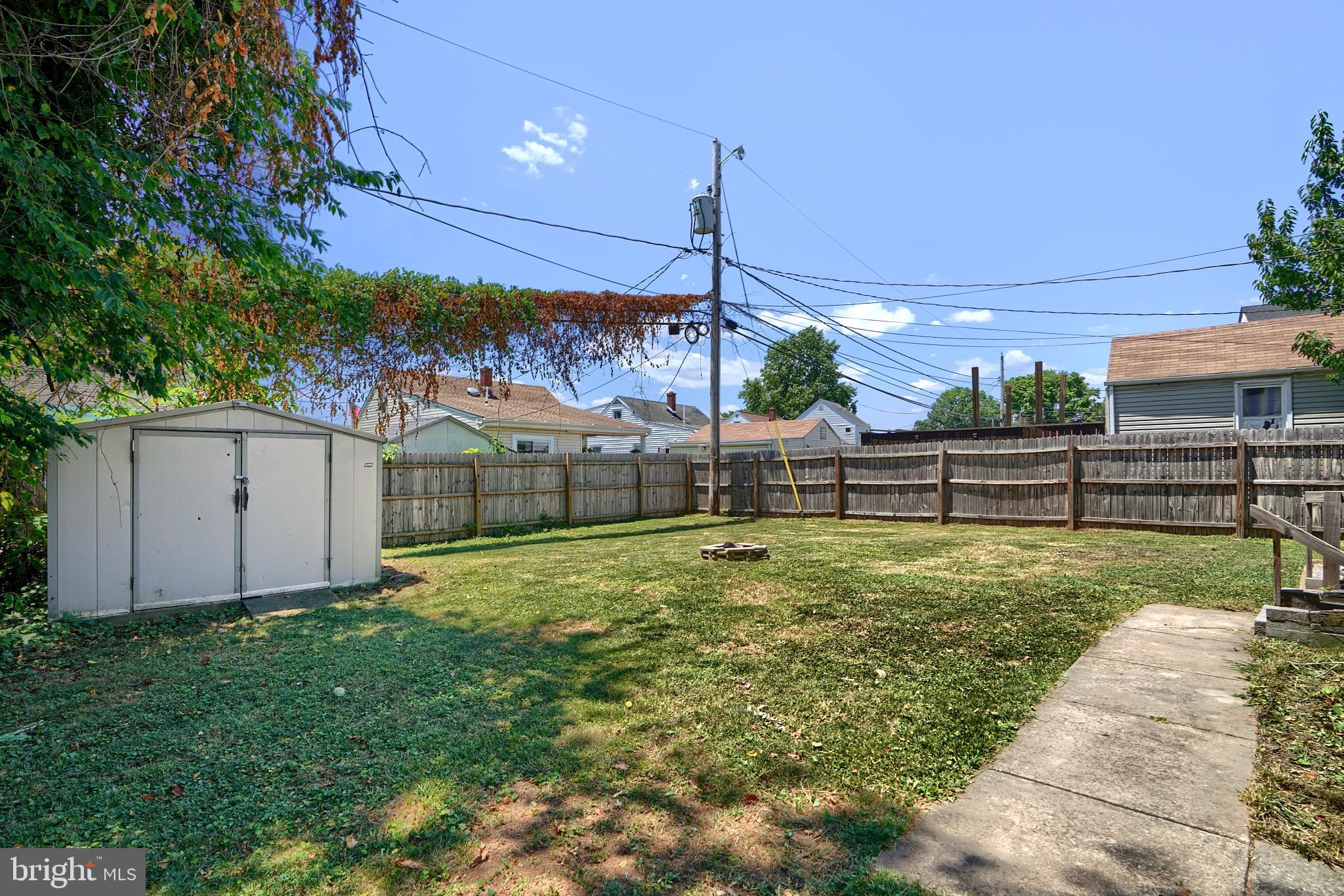8239 Bullneck Road Dundalk, MD 21222 - Photo 29 of 35 Deck, shed , fire pit, fully privacy fenced yard