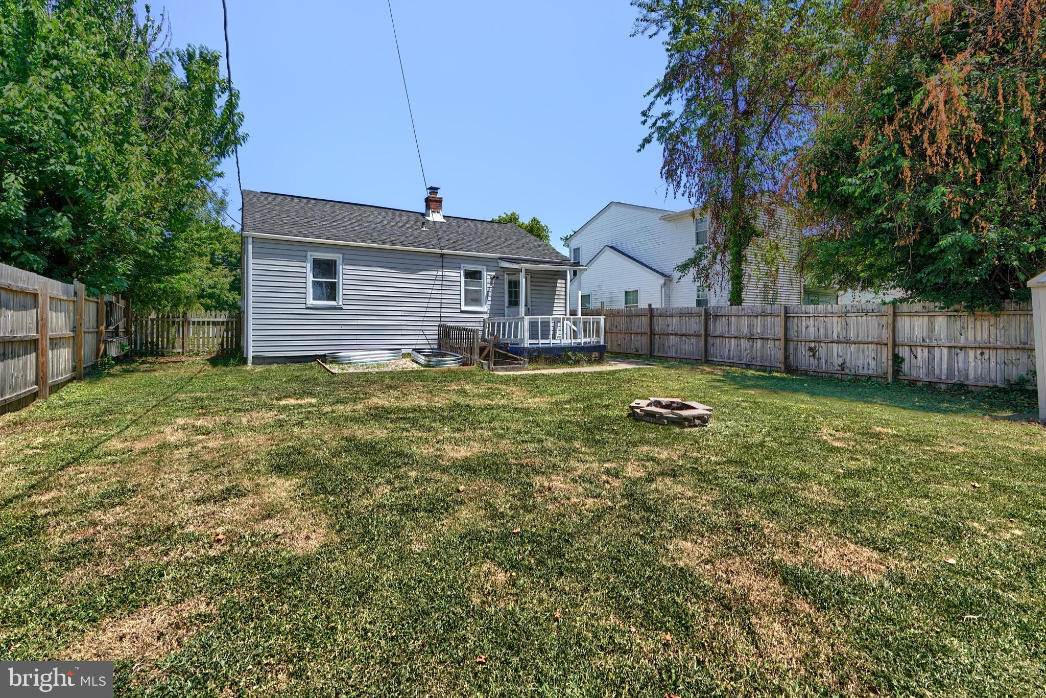 8239 Bullneck Road Dundalk, MD 21222 - Photo 31 of 35 Deck, shed , fire pit, fully privacy fenced yard
