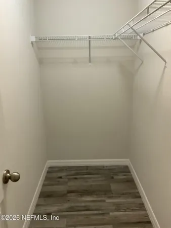 a view of a room with racks on the wall