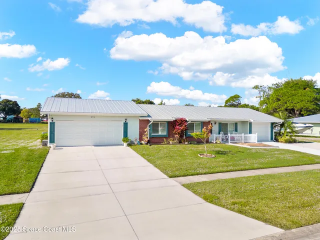 a view of a chair and tables in the patio
