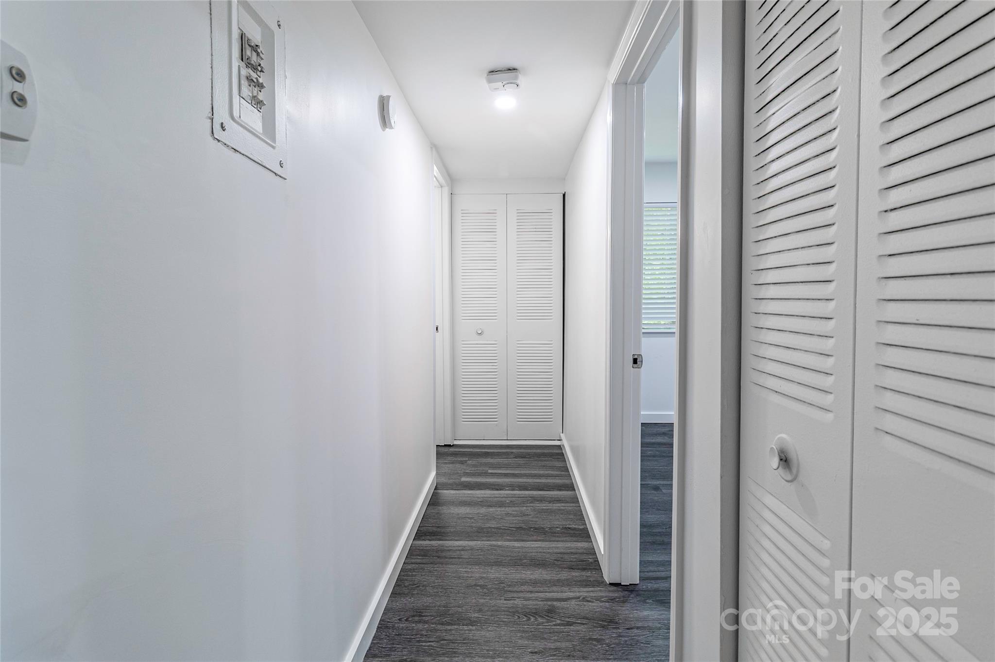 338 Orchard Trace Lane, Unit 8 Charlotte, NC 28213 - Photo 12 of 15 a view of a hallway with wooden floor and staircase