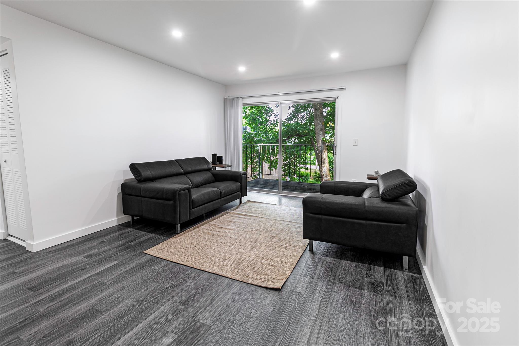 338 Orchard Trace Lane, Unit 8 Charlotte, NC 28213 - Photo 4 of 15 a living room with furniture and a window