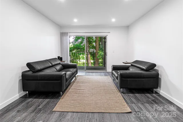 a living room with furniture and a rug