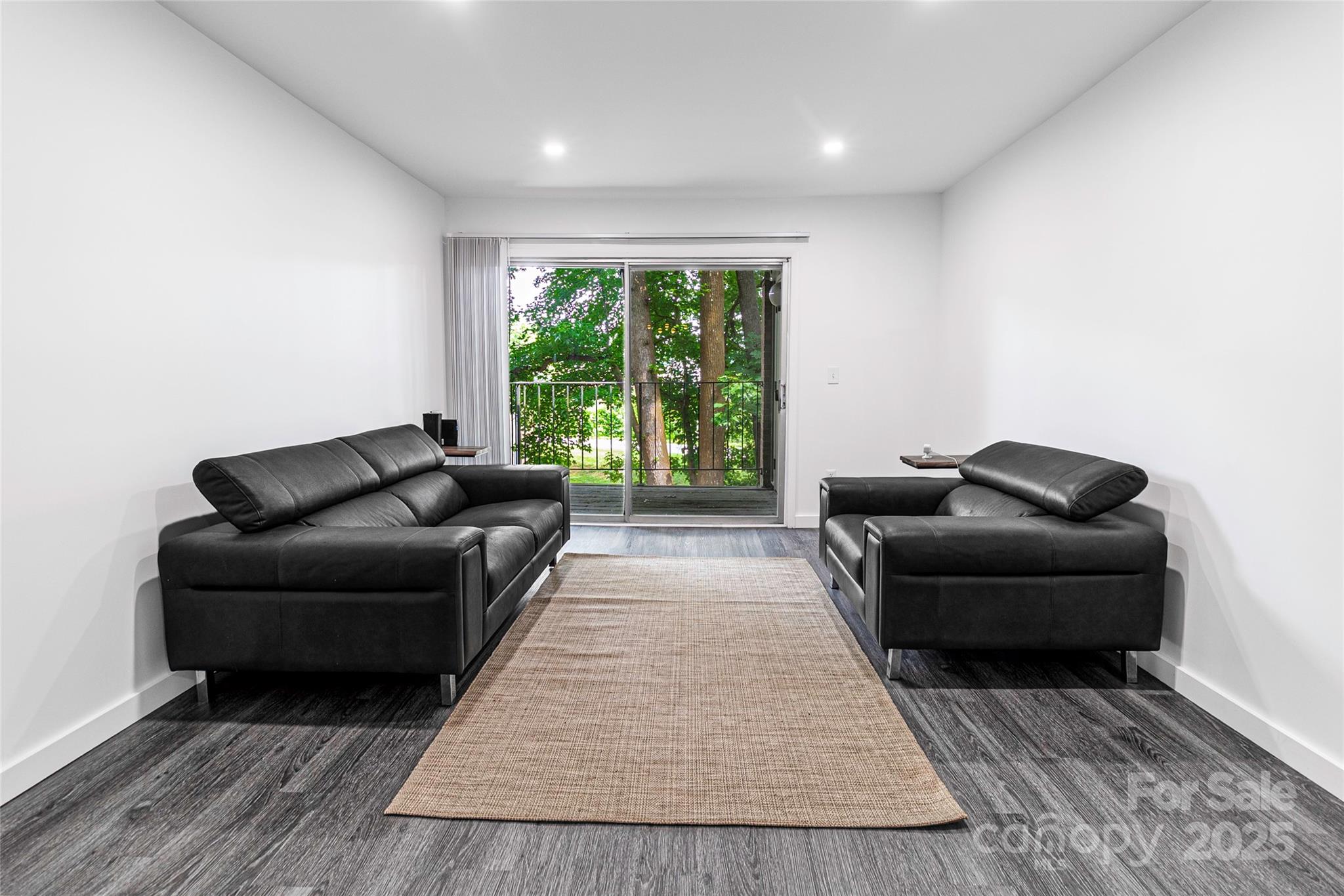 338 Orchard Trace Lane, Unit 8 Charlotte, NC 28213 - Photo 6 of 15 a living room with furniture and a rug