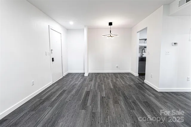 an empty room with wooden floor