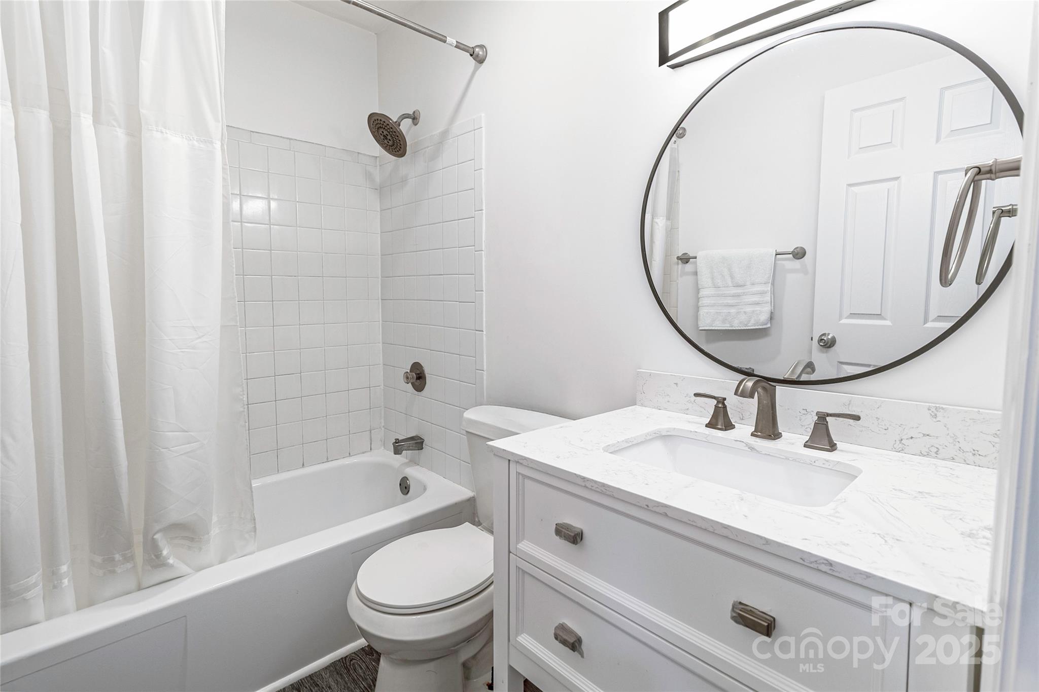 338 Orchard Trace Lane, Unit 8 Charlotte, NC 28213 - Photo 10 of 15 a bathroom with a sink a toilet and a mirror