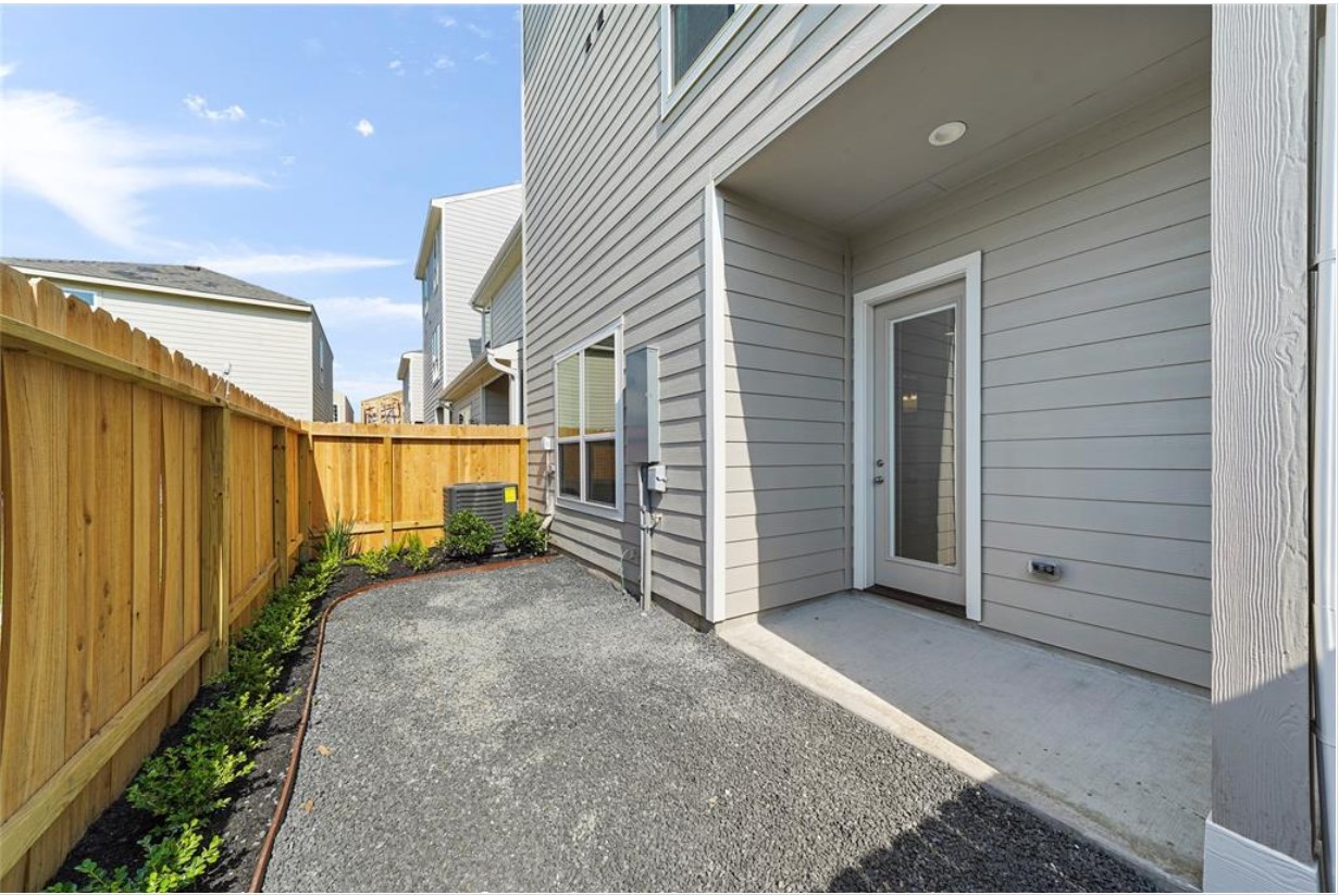 11013 Cres Light Way Houston, TX 77043 - Photo 11 of 14 a view of a house with wooden fence