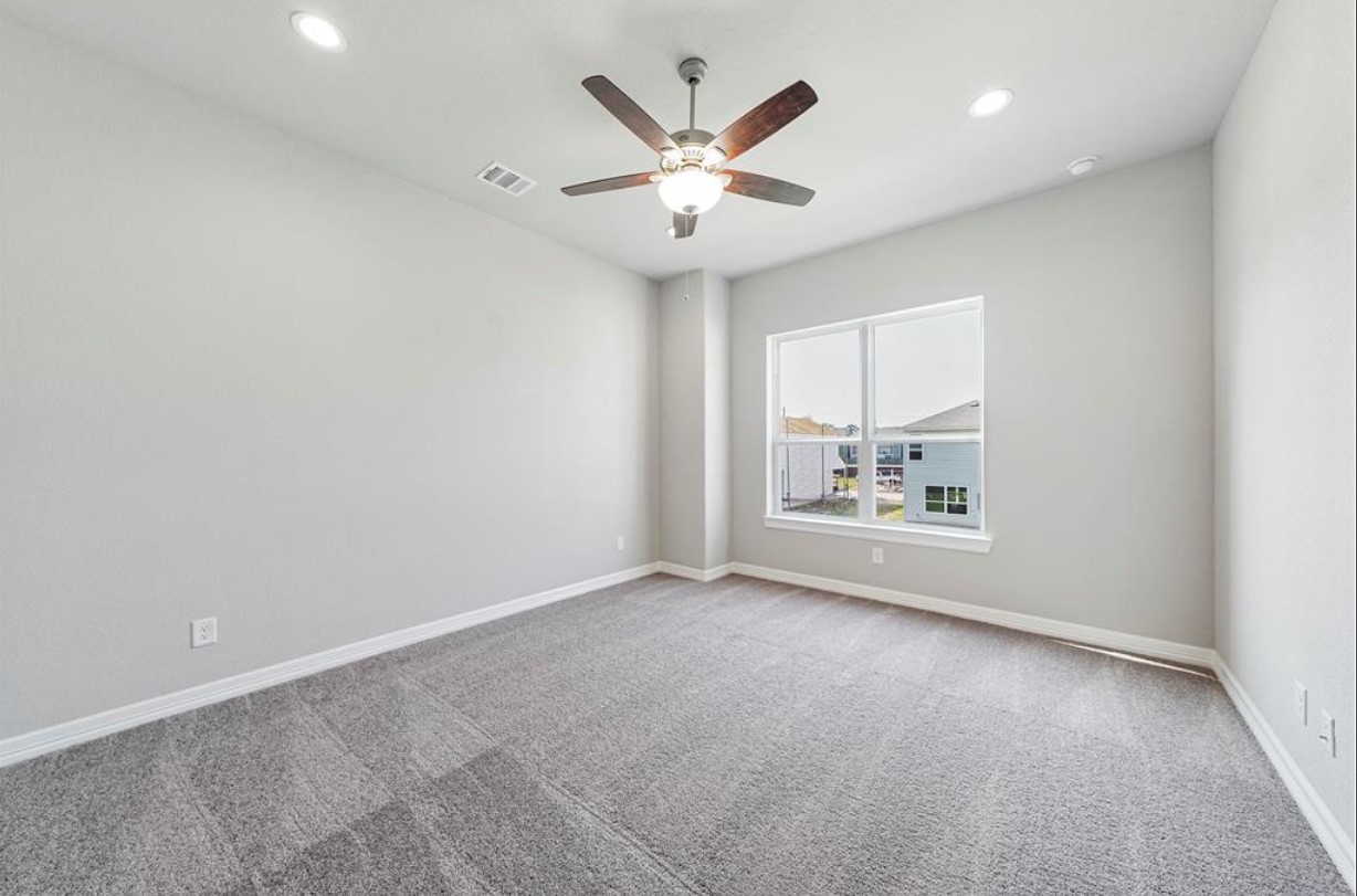 11013 Cres Light Way Houston, TX 77043 - Photo 7 of 14 an empty room with fan and windows