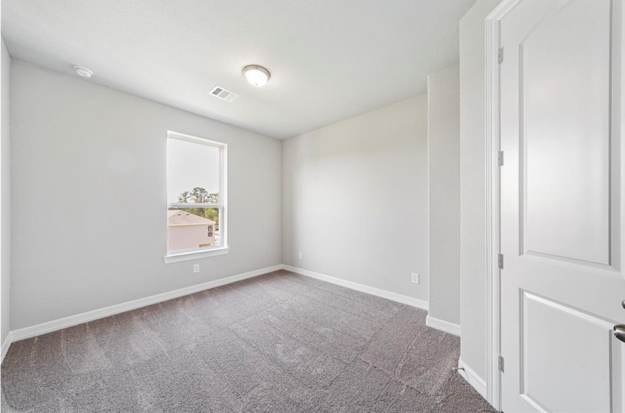 11013 Cres Light Way Houston, TX 77043 - Photo 9 of 14 an empty room with a window