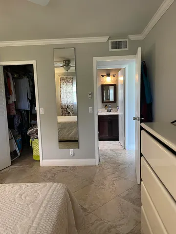 a view of a refrigerator and a stove