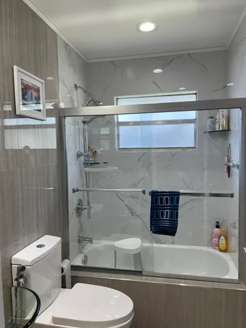 a bedroom with a bed and a lamp