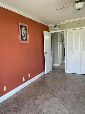 a bathroom with a sink vanity and toilet