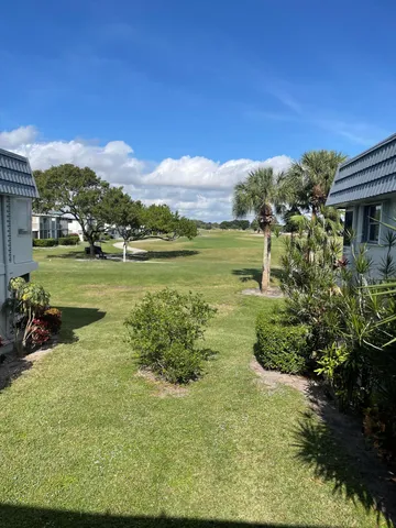 a view of a lake with a big yard