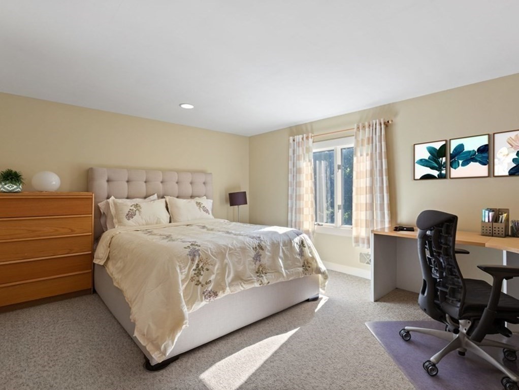 120 Country Club Road Newton, MA 02459 - Photo 15 of 25 a spacious bedroom with a bed and a desk
