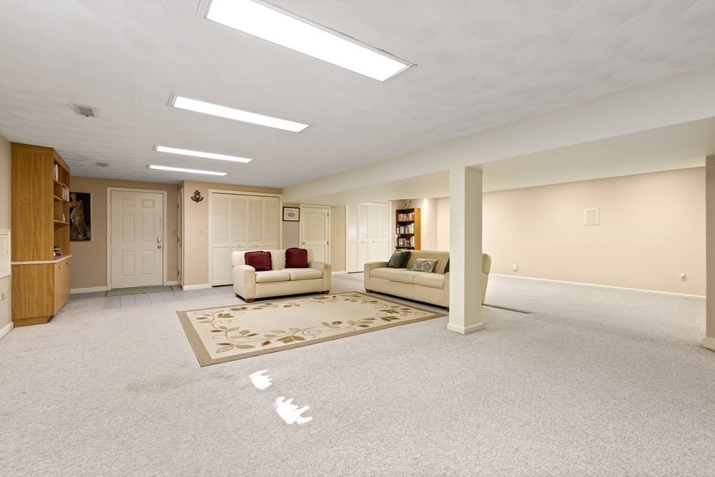 120 Country Club Road Newton, MA 02459 - Photo 18 of 25 a living room with furniture and a table