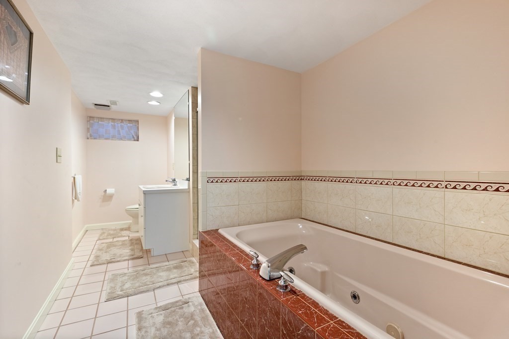 120 Country Club Road Newton, MA 02459 - Photo 20 of 25 a bathroom with a tub and shower