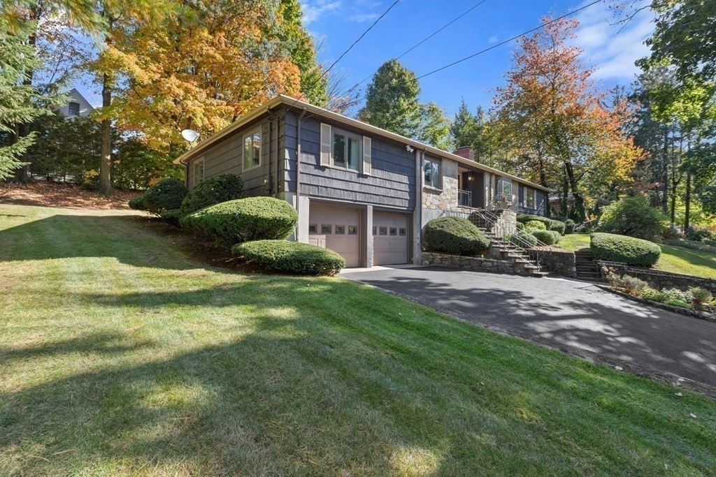 120 Country Club Road Newton, MA 02459 - Photo 21 of 25 a front view of a house with a yard