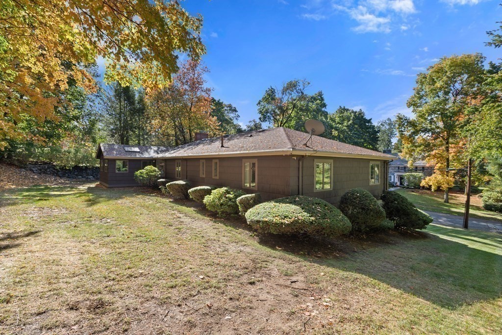 120 Country Club Road Newton, MA 02459 - Photo 23 of 25 a front view of a house with a yard