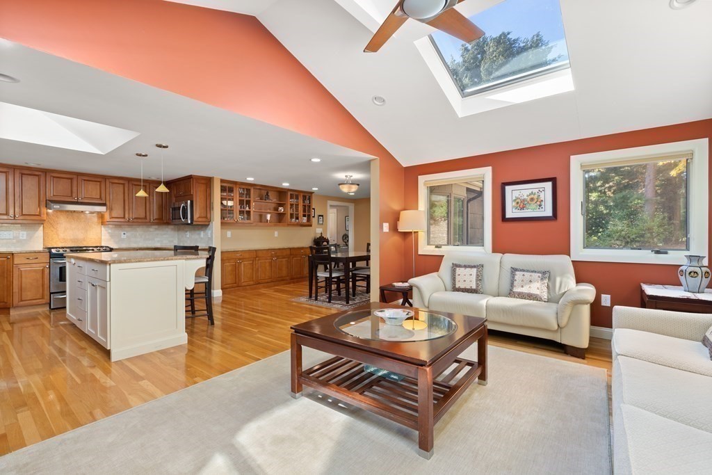 120 Country Club Road Newton, MA 02459 - Photo 7 of 25 a living room with furniture and a kitchen view