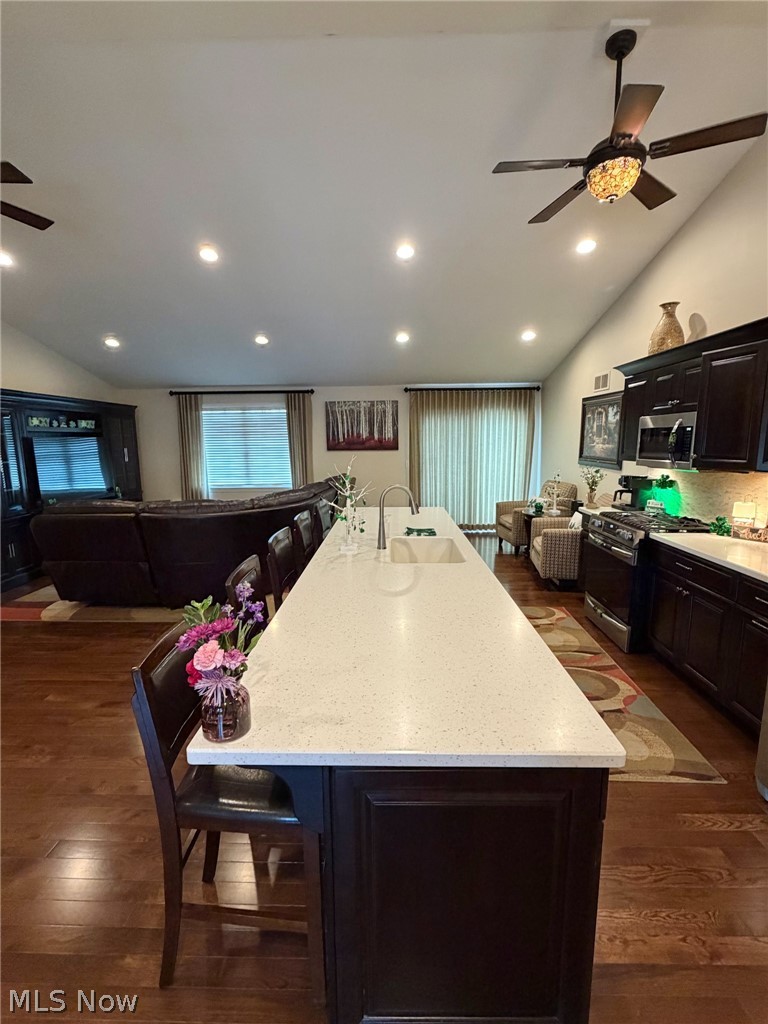 1343 Courtland Road Weirton, WV 26062 - Photo 9 of 50 Kitchen with a ceiling fan, a breakfast bar, stainless steel appliances, light stone counters, and an island with sink