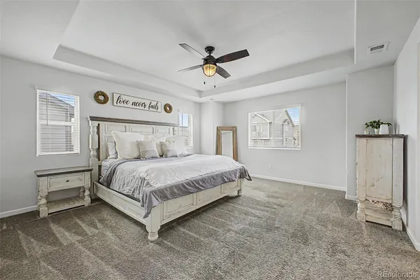 a bedroom with a bed dresser and a window