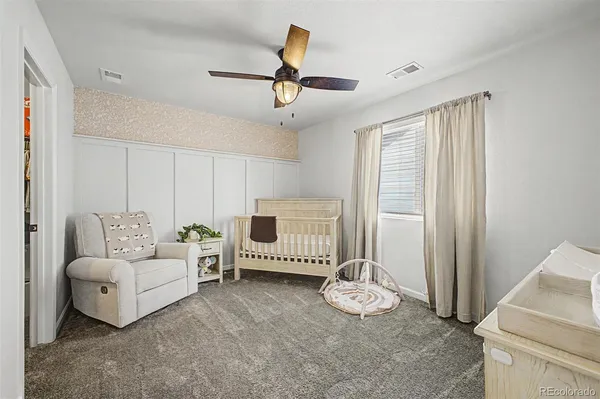 a living room with furniture and white walls