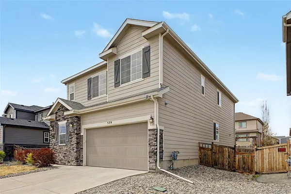 a front view of a house with a garage