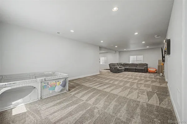 a view of kitchen with a sink cabinets and a couch