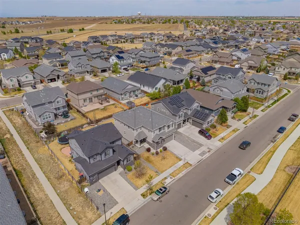 an aerial view of residential building with parking