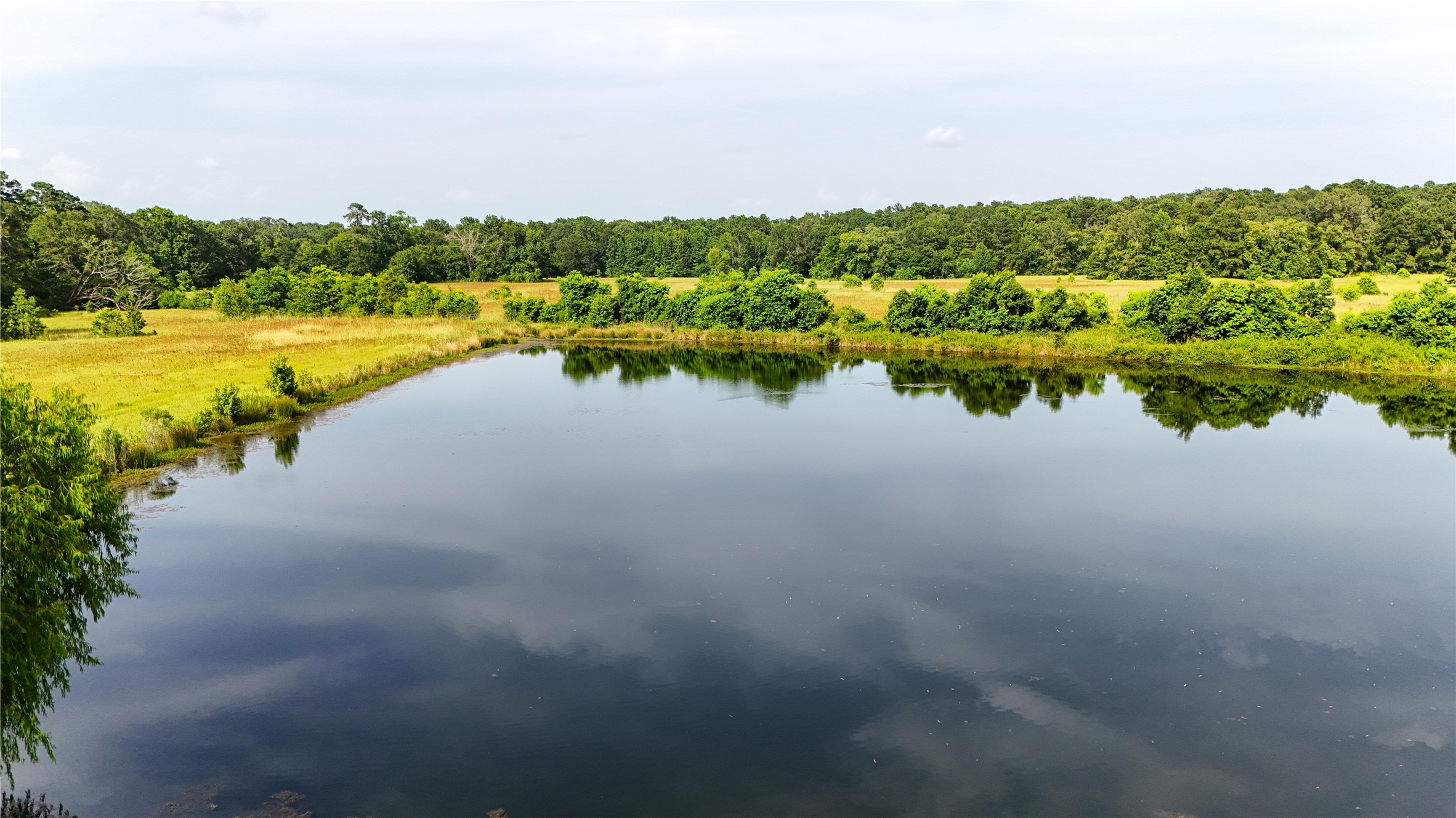 287 Loop 287 Frontage Road Lufkin, TX 75901 - Photo 12 of 22 a view of a lake with houses in the back