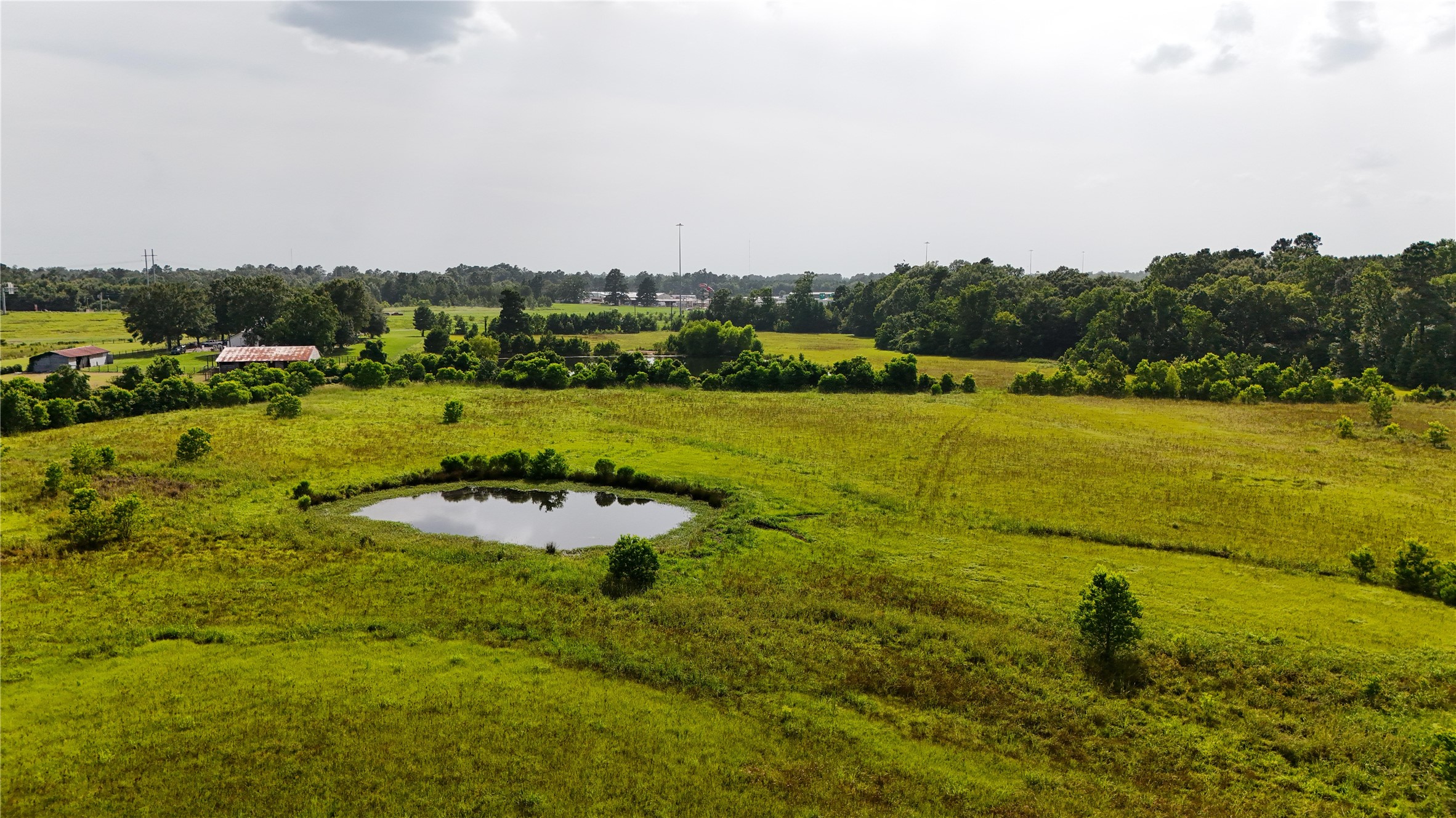 287 Loop 287 Frontage Road Lufkin, TX 75901 - Photo 16 of 22 a view of a lake with a yard