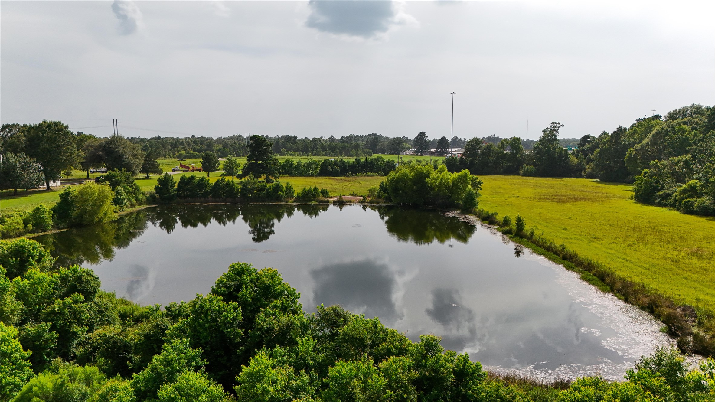 287 Loop 287 Frontage Road Lufkin, TX 75901 - Photo 4 of 22 a view of a lake with houses in the back