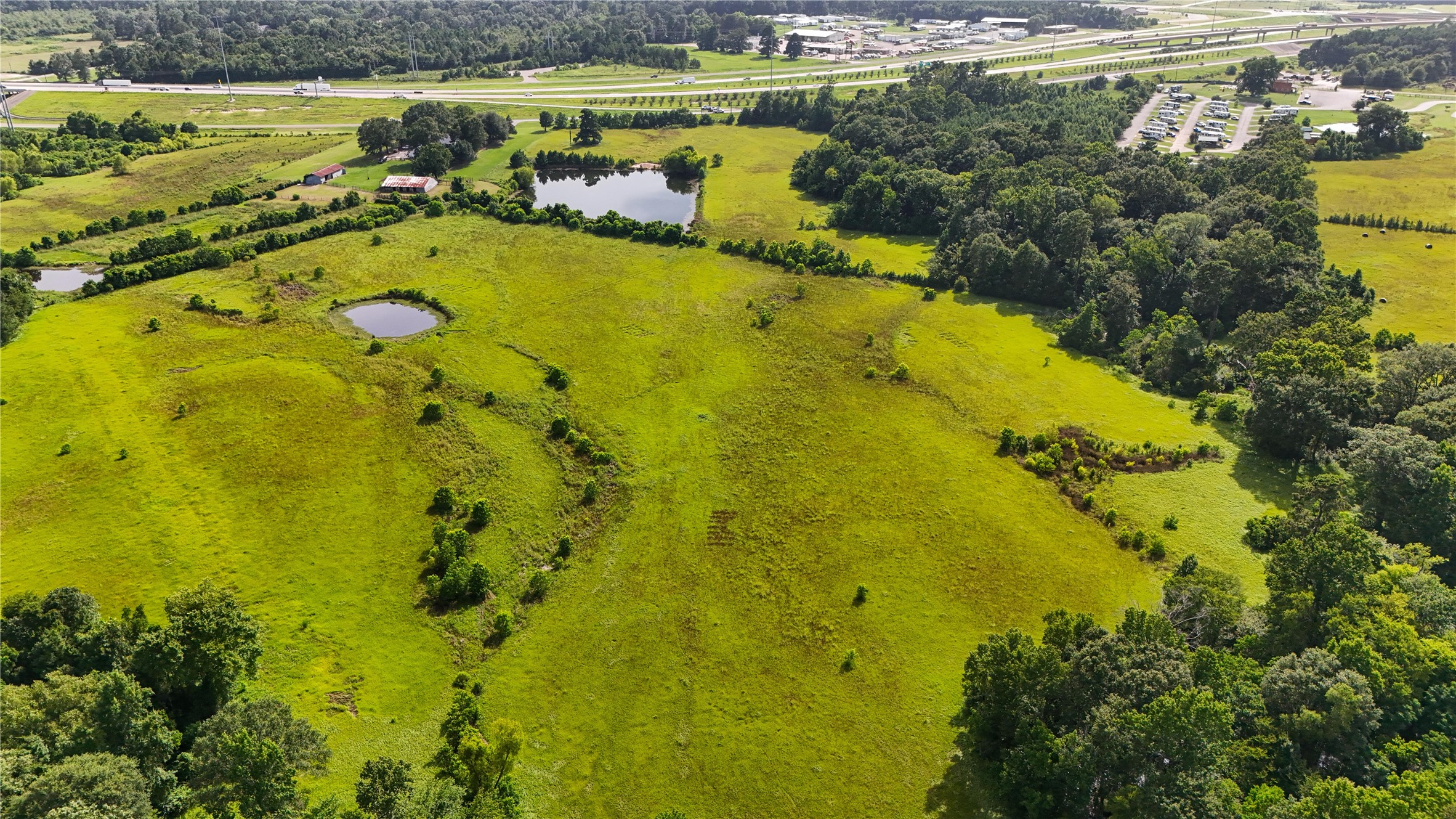 287 Loop 287 Frontage Road Lufkin, TX 75901 - Photo 5 of 22 a view of a lake with a houses
