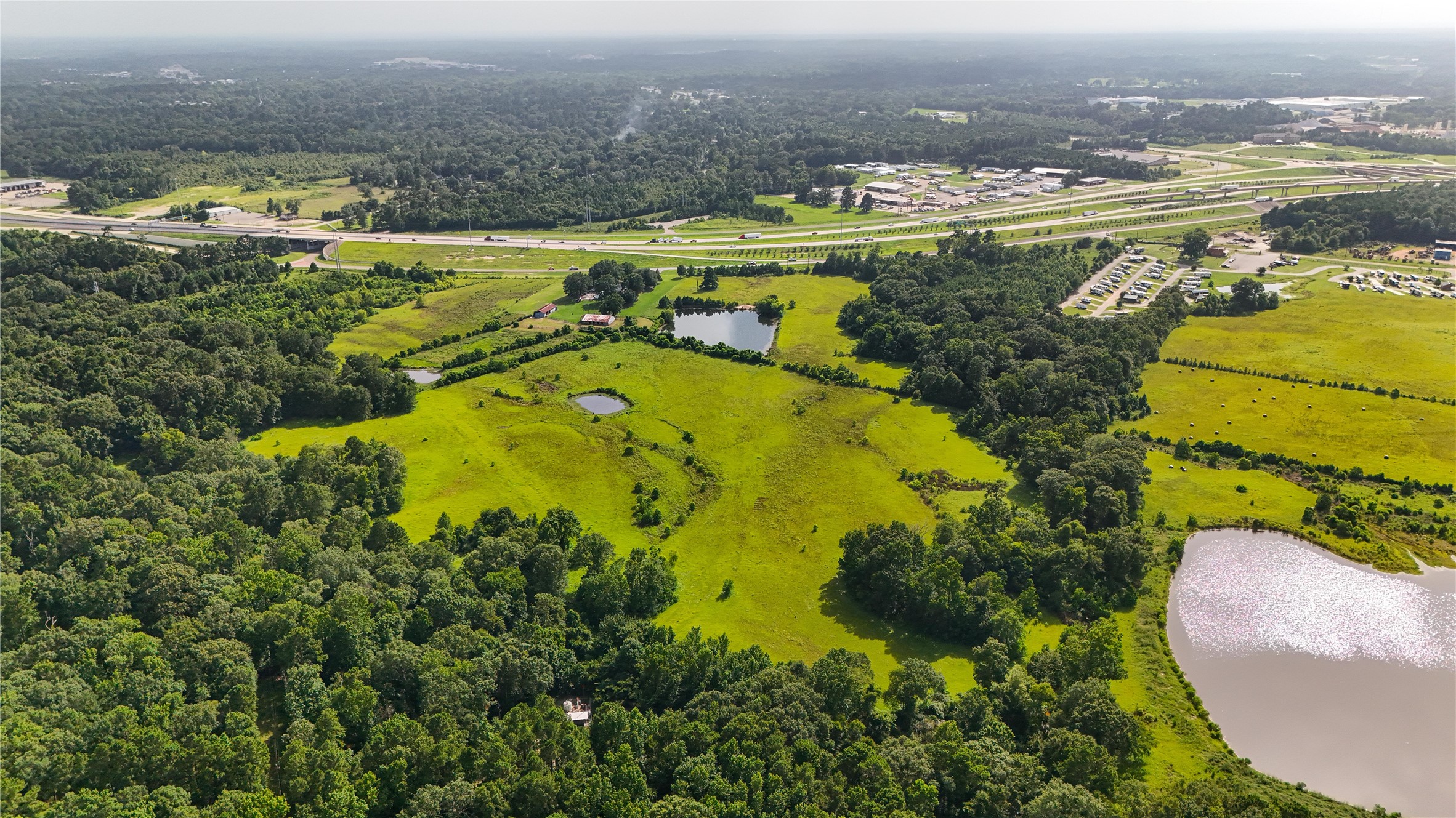 287 Loop 287 Frontage Road Lufkin, TX 75901 - Photo 6 of 22 an aerial view of residential houses with outdoor space and swimming pool