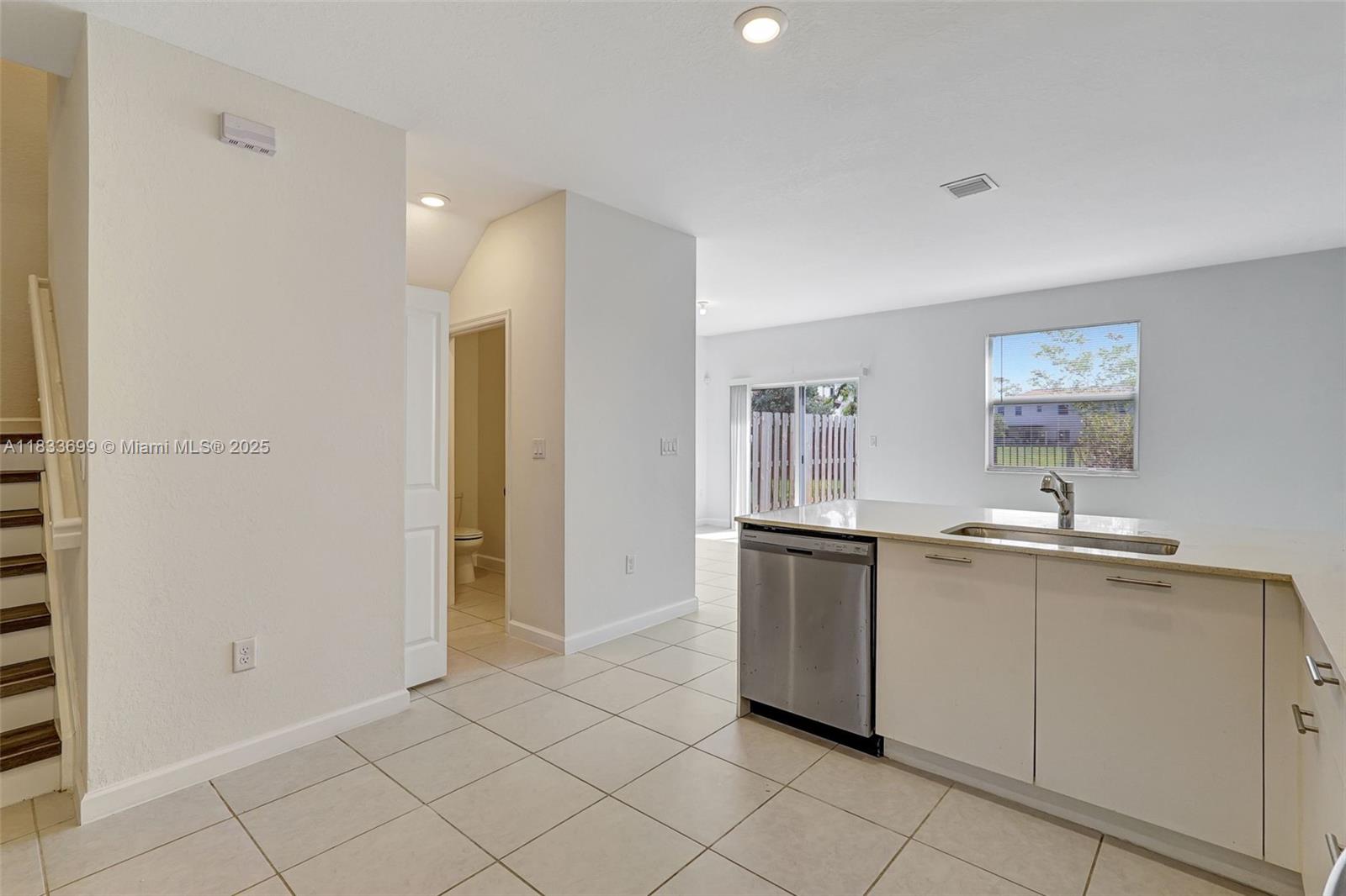 Gladeview Miami, FL 33147 - Photo 11 of 42 a kitchen with stainless steel appliances granite countertop a sink and cabinets