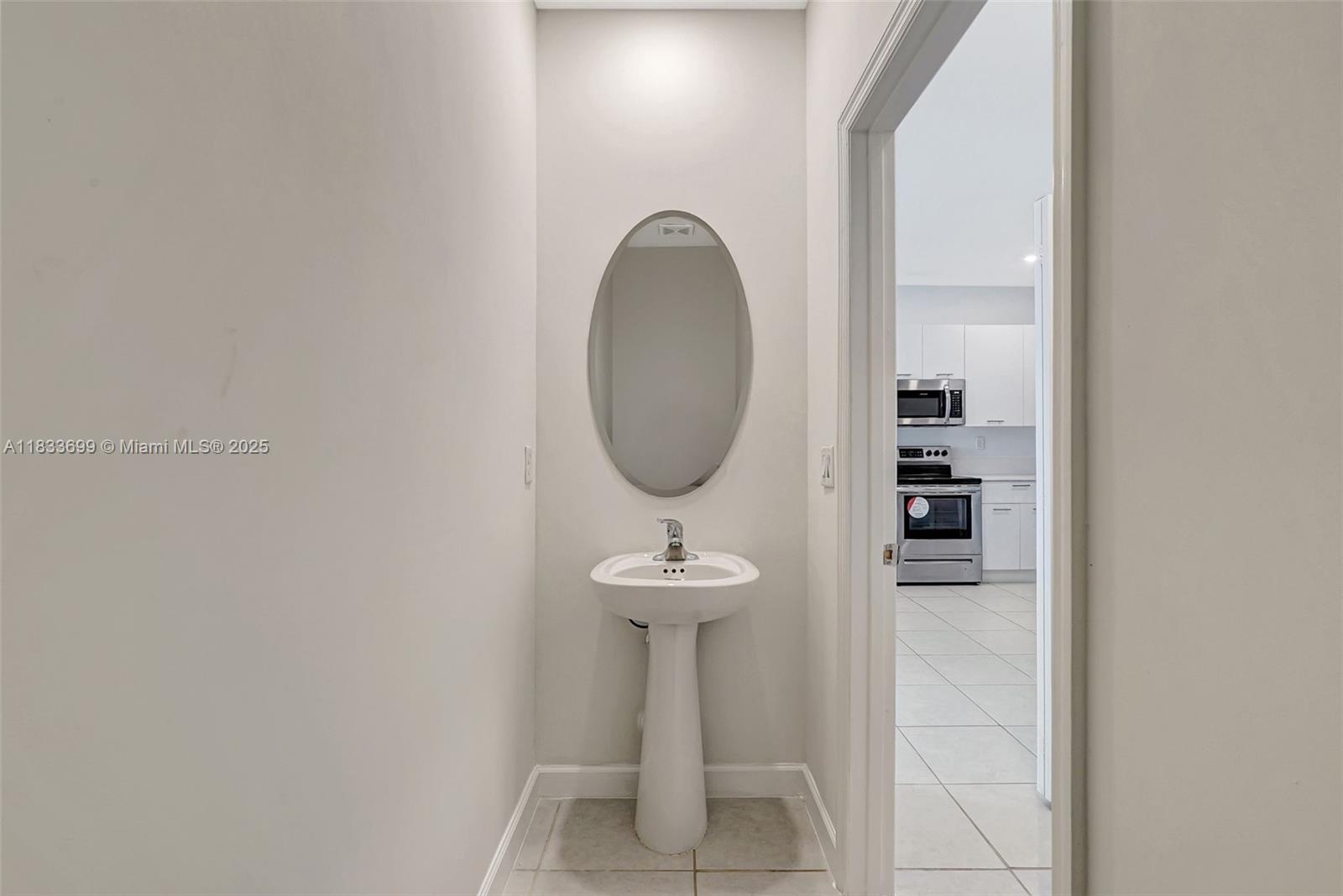 Gladeview Miami, FL 33147 - Photo 14 of 42 a bathroom with a sink and mirror